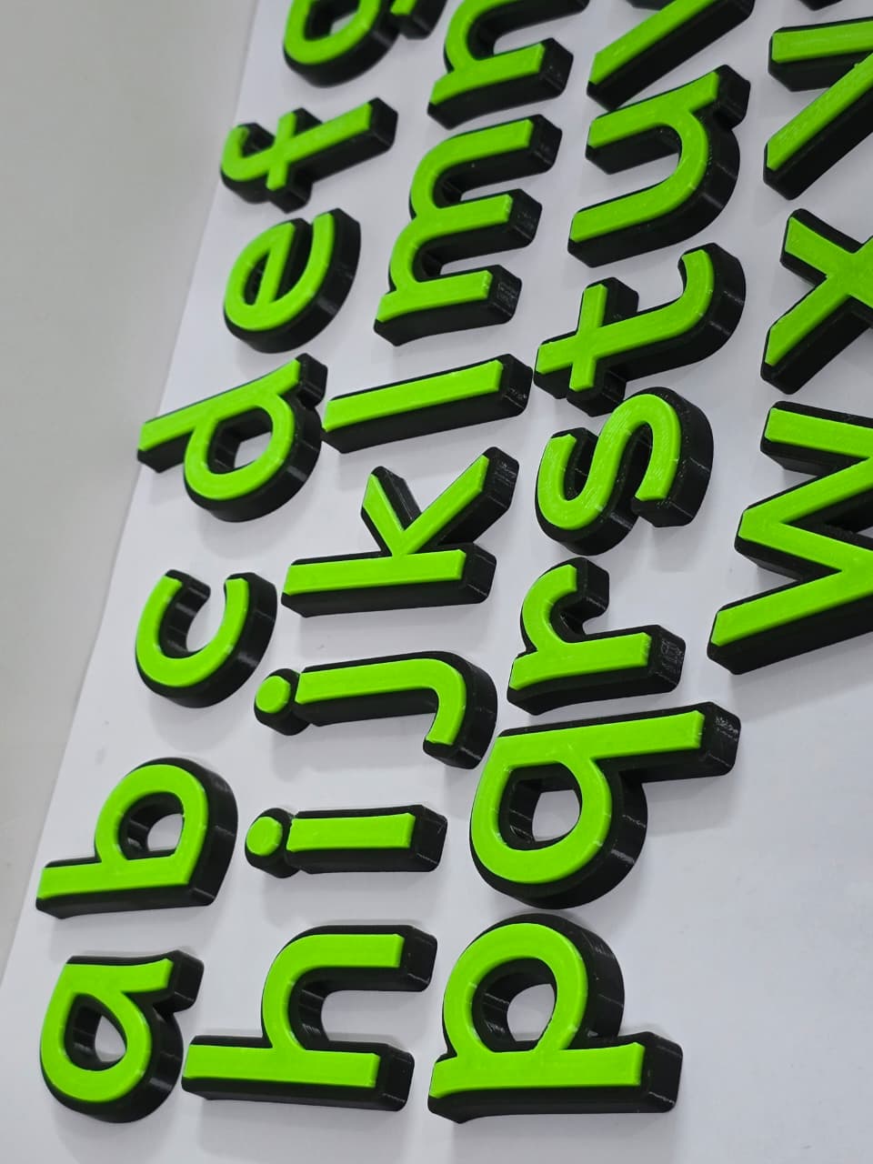 Lowercase alphabets black green