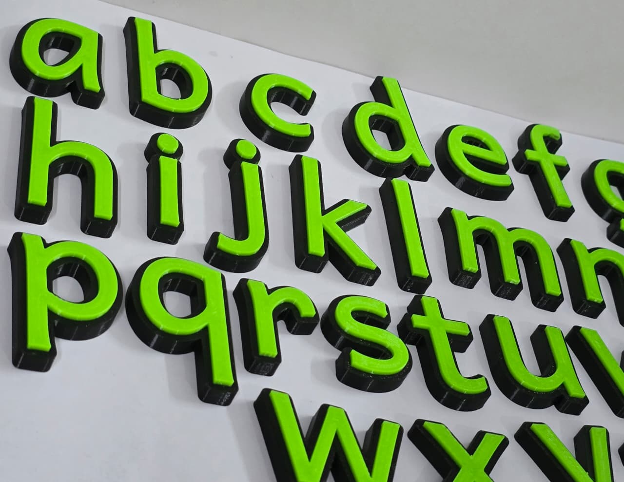 Lowercase alphabets black green