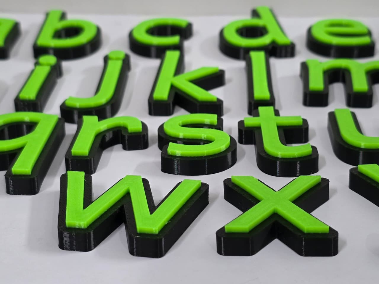 Lowercase alphabets black green